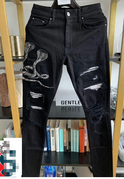 Jean déchiré imprimé serpent-noir