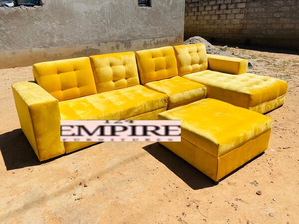 Yellow upholstered sofa and ottoman