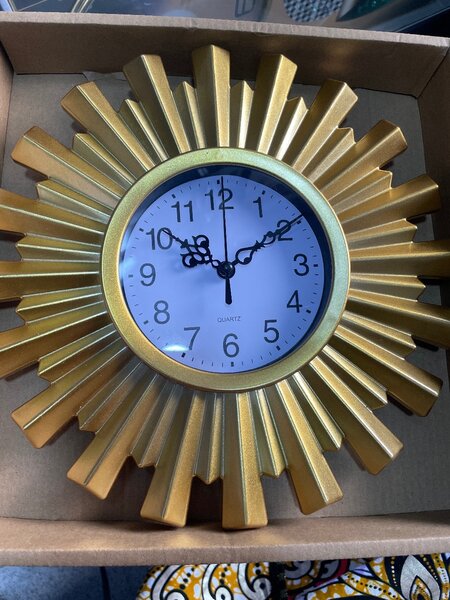 Horloge murale dorée design