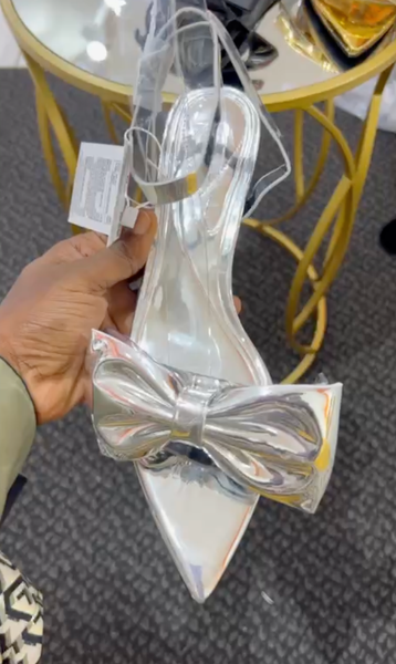 Patent leather silver shoes with a bow