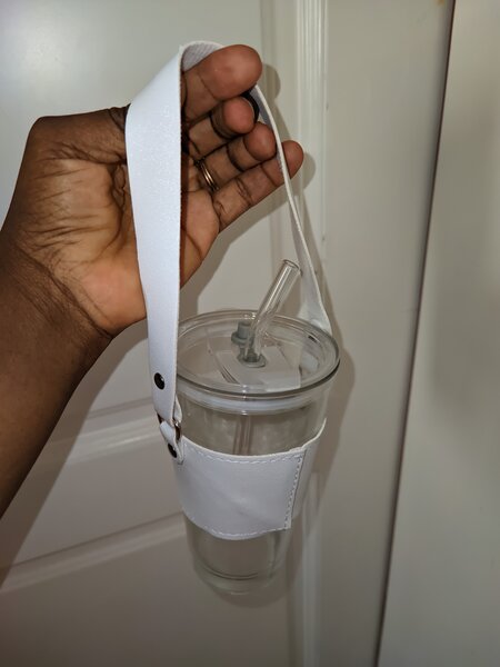 Glass Tumblers with leather handle.