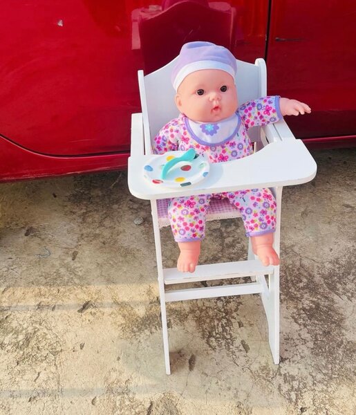 Doll in a highchair