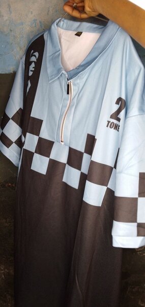 Polo rayée unisexe à zip