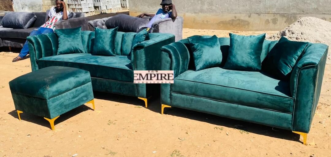 A set of furniture, green sofas and an ottoman