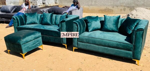 A set of furniture, green sofas and an ottoman