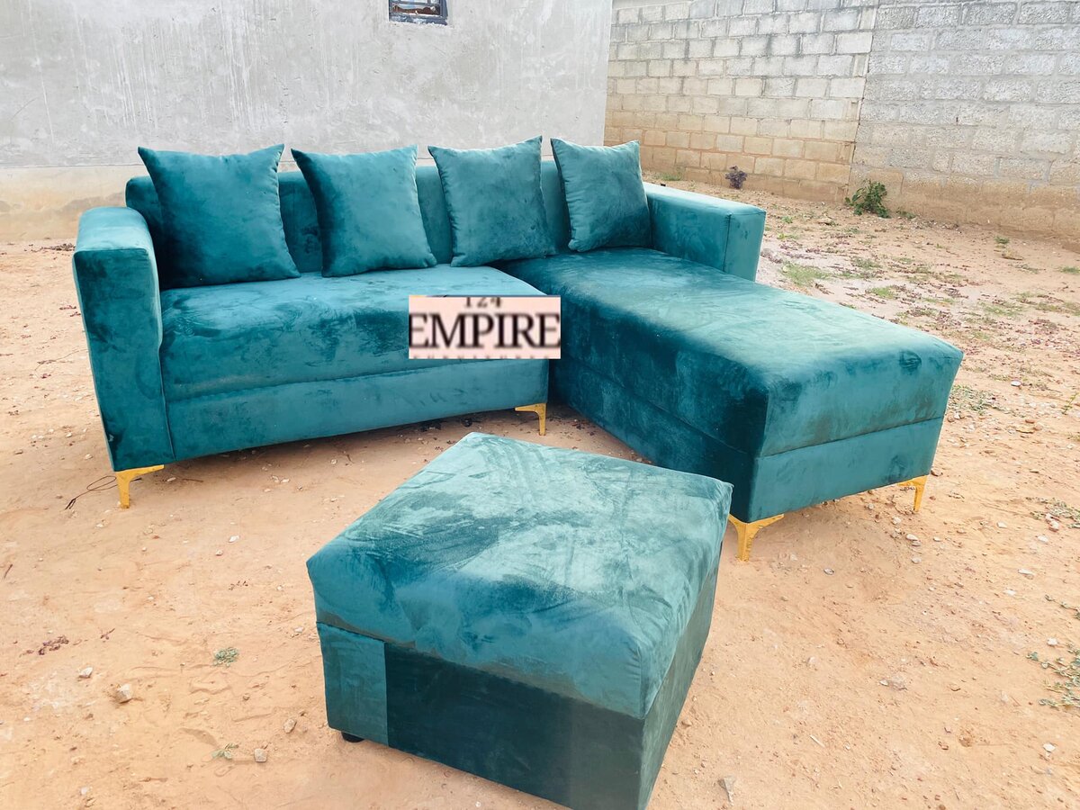 Turquoise upholstered sofa and ottoman
