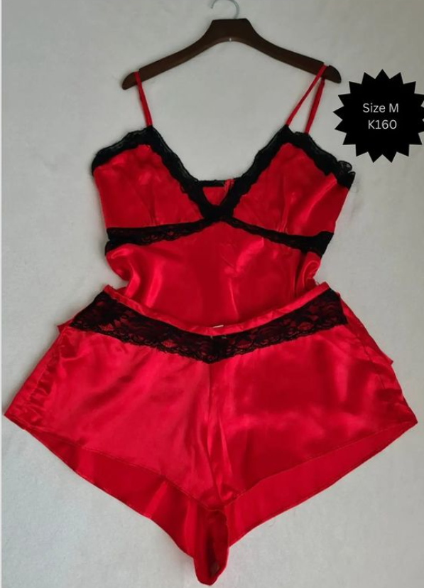 T-shirt and shorts are red