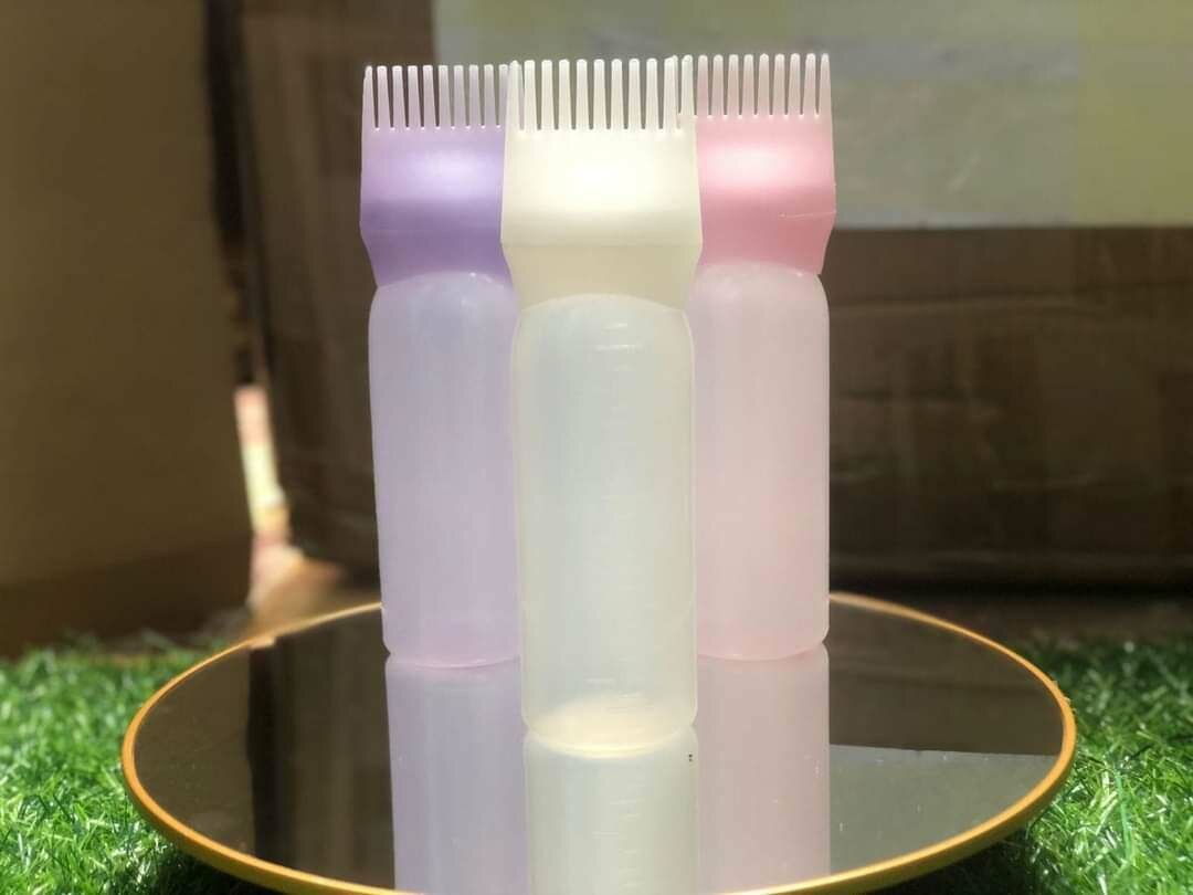 Applicateur d'huile de cheveux