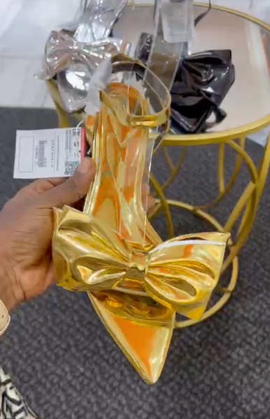 Patent leather gold shoes with a bow