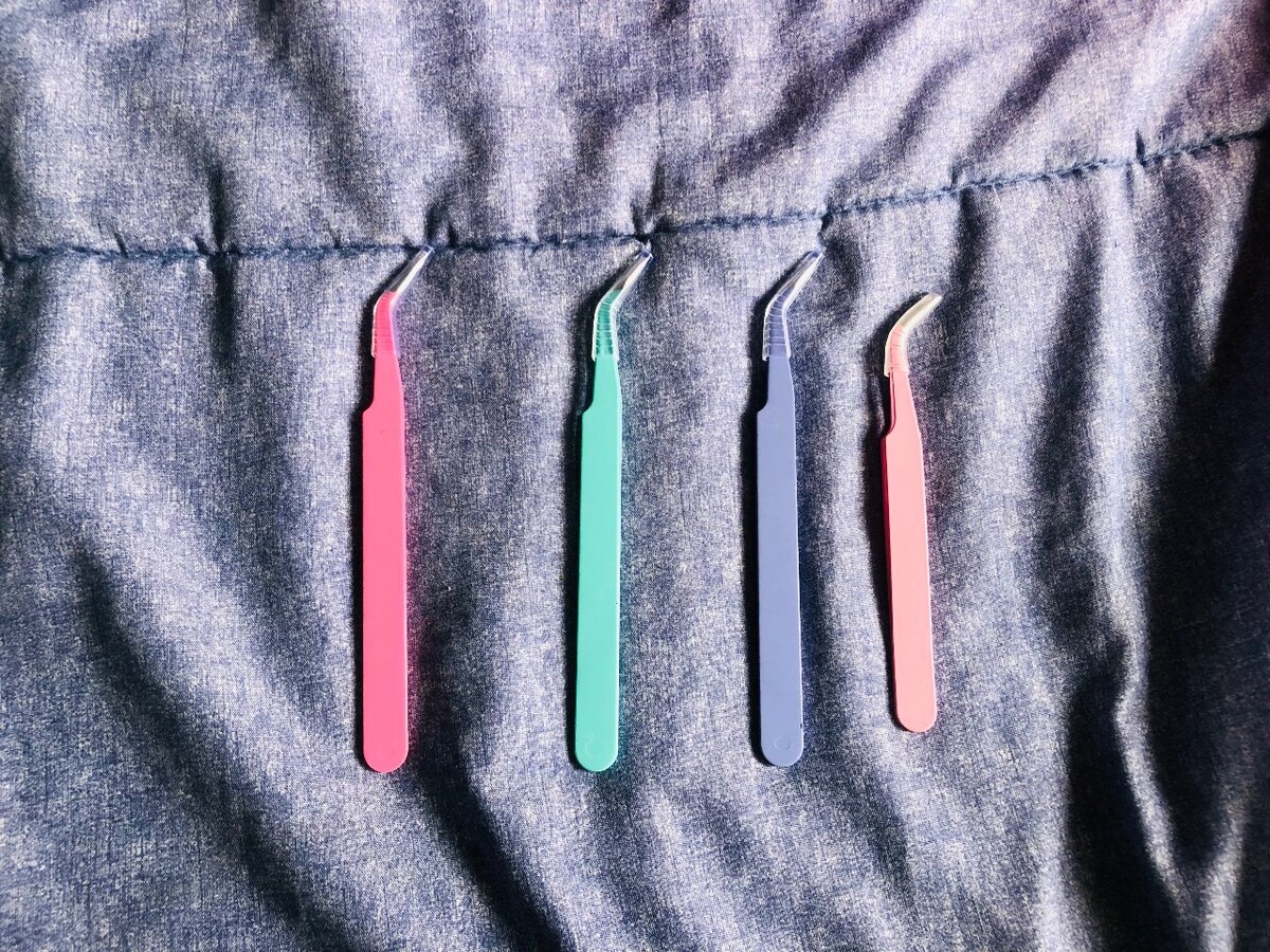 Lash and eyebrow tweezers each