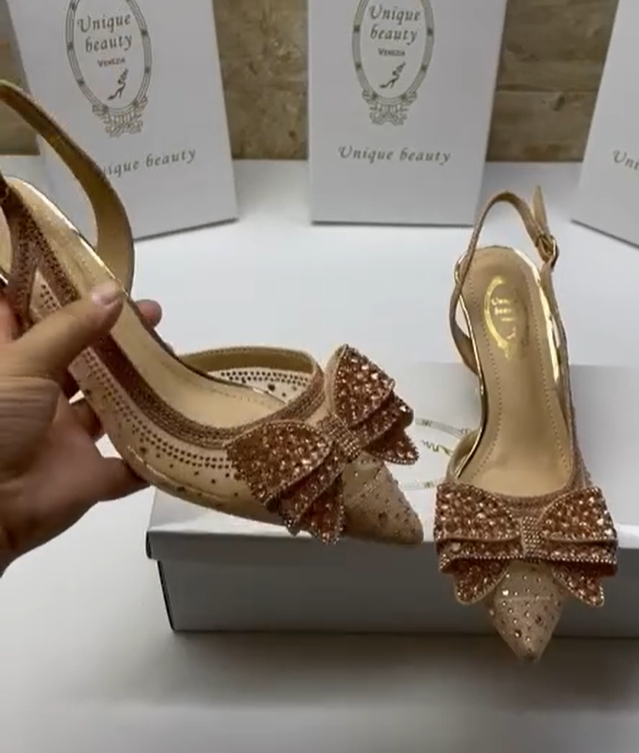 gold shoes with a bow tie