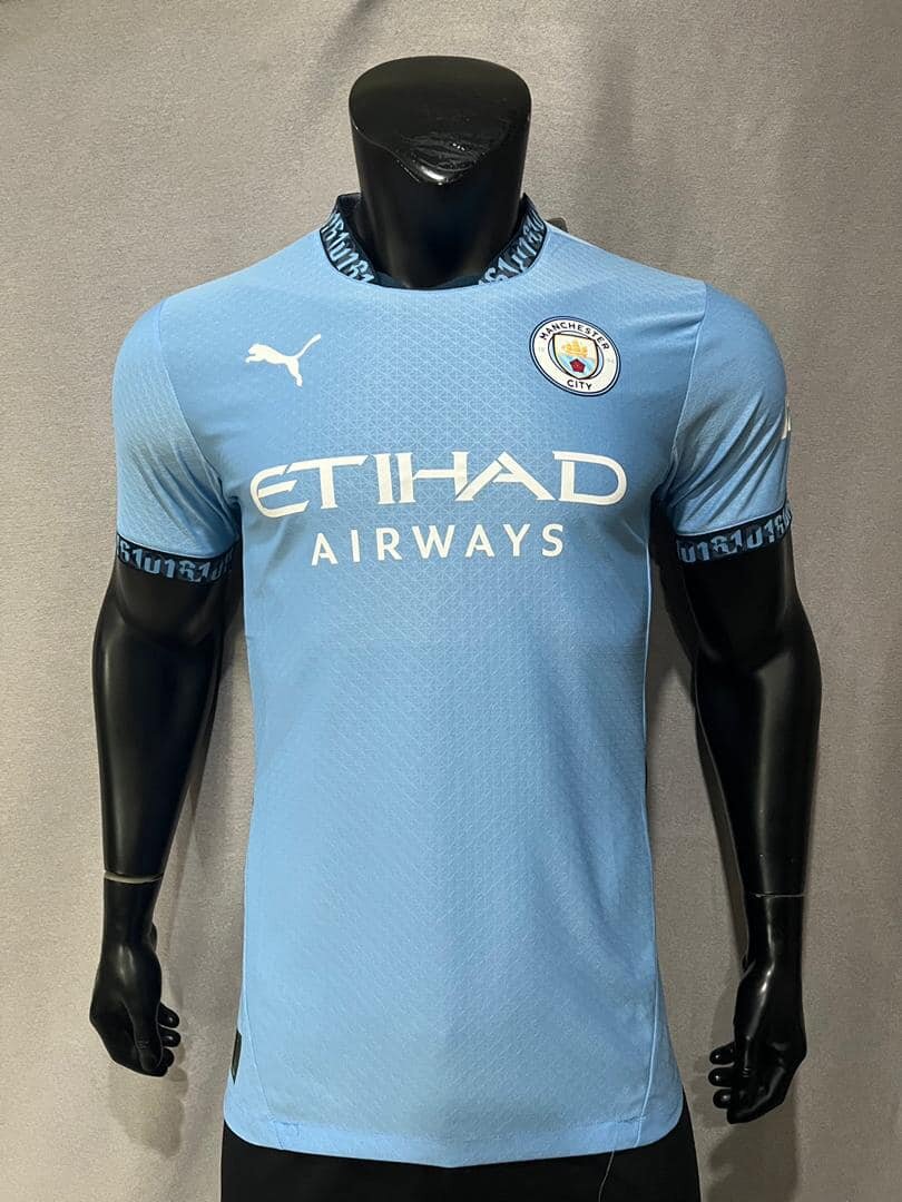 Manchester City men's soccer uniform in blue with Puma and Etihad Airways logos