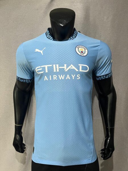 Manchester City men's soccer uniform in blue with Puma and Etihad Airways logos