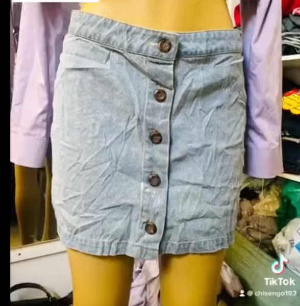 Denim mini skirt with metal buttons
