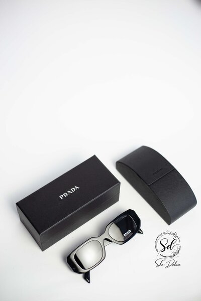 PRADA ASYMMETRIC ARM SUNGLASSES