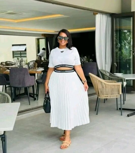 Suit shortened blouse and pleated skirt in white color