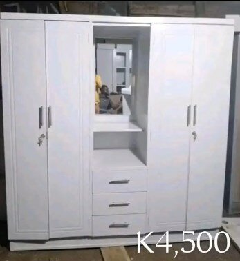 White wardrobe with drawers and mirror