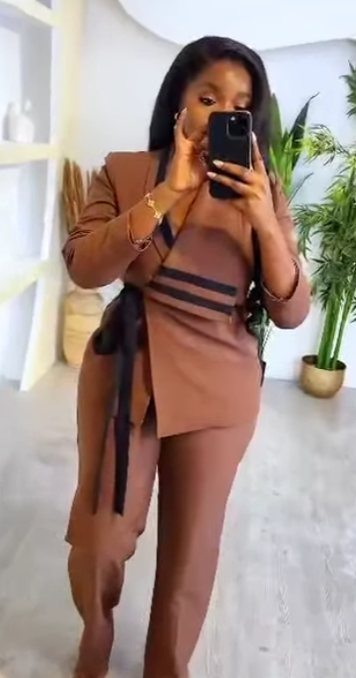 Women's light brown suit with black inserts