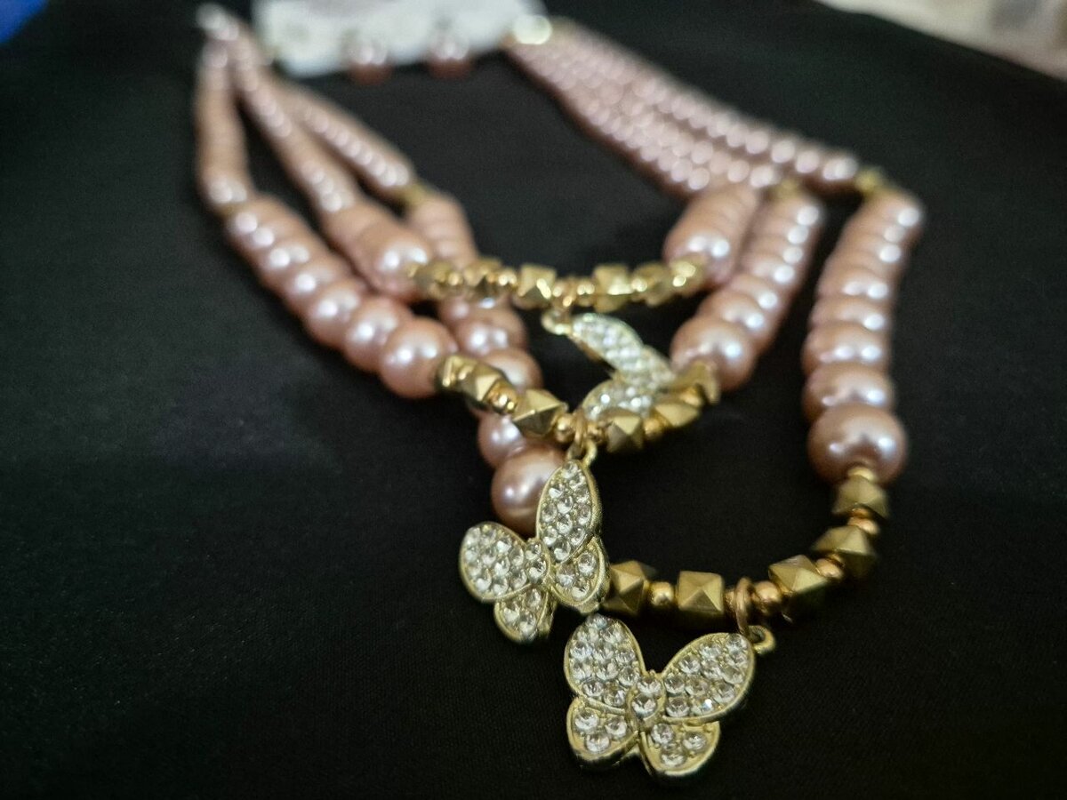 Necklace with small earrings.