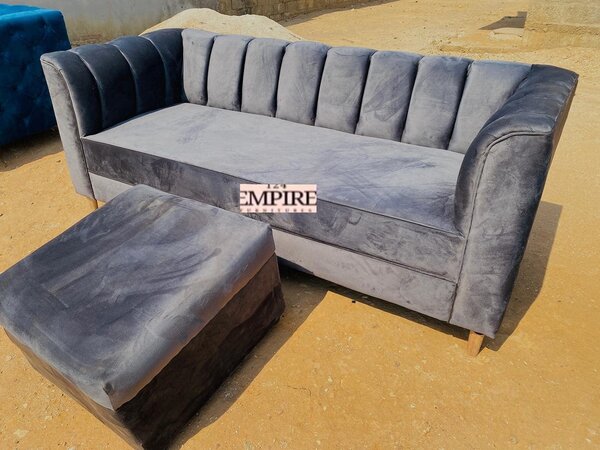 Sofa and ottoman with grey upholstery