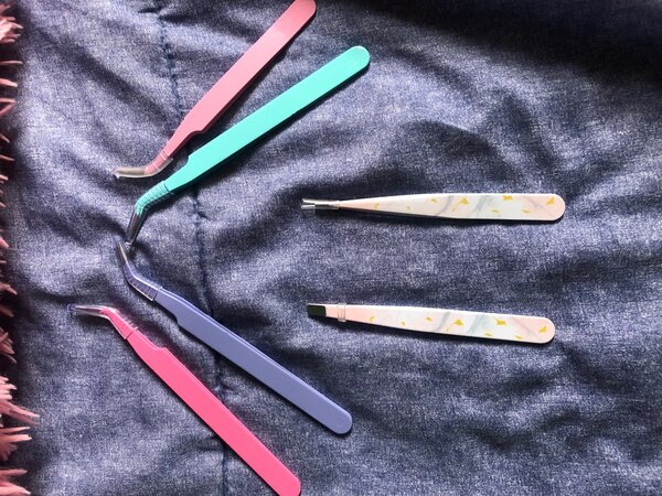 Lash and eyebrow tweezers each