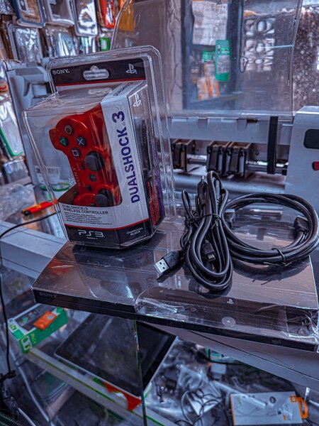 Console PlayStation 3 avec manette