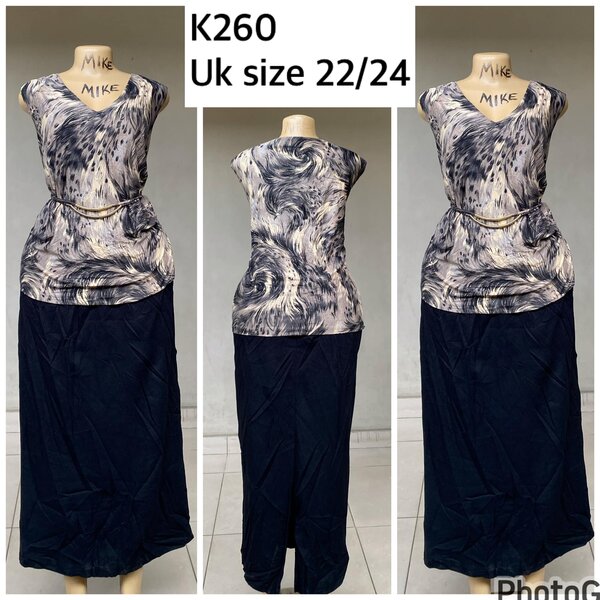 patterned blouse and black skirt