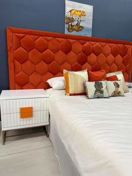 bed with orange headboard