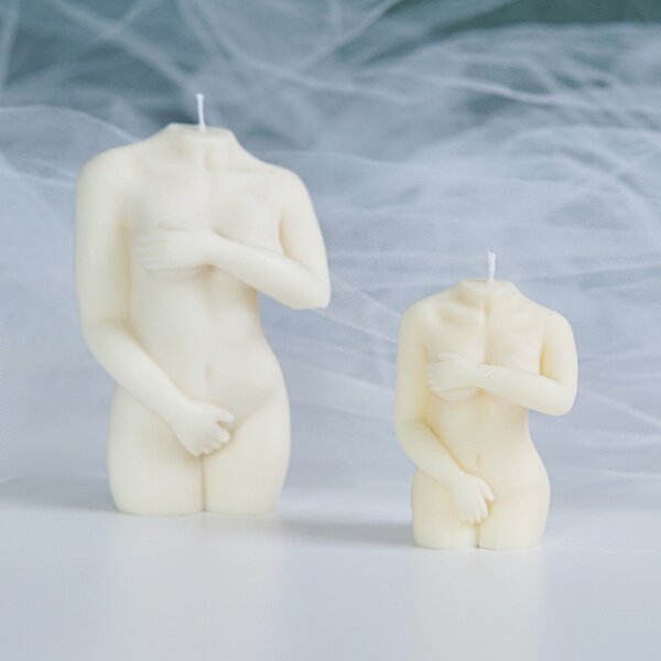 Lady with hands covering top and down candle mould