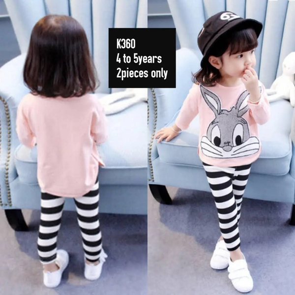 pink sweater with a bunny and striped leggings