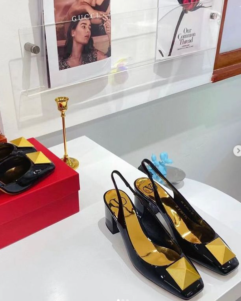 black shoes with gold toe