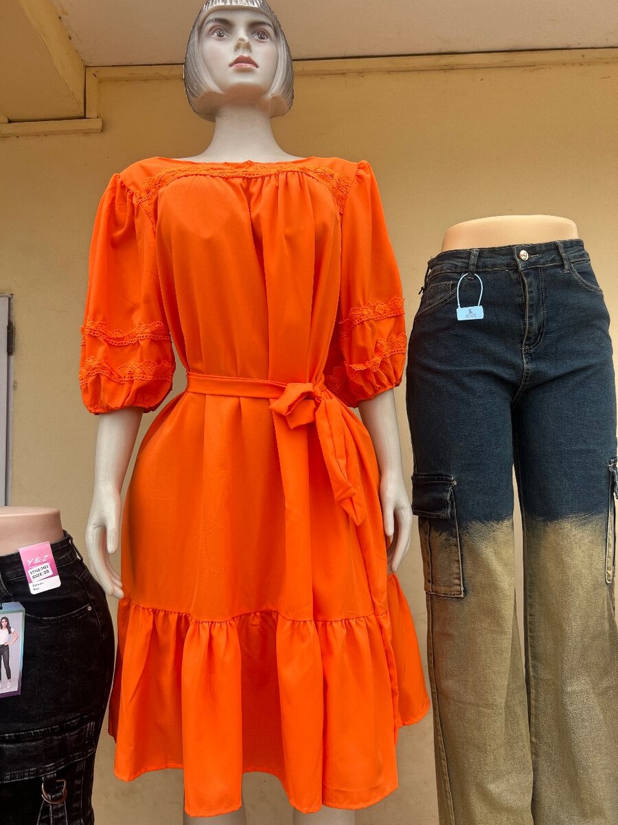 Dresses and jeans available in sizes.