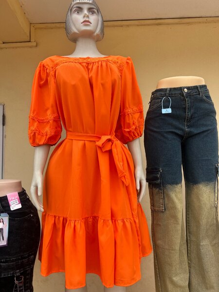 Dresses and jeans available in sizes.