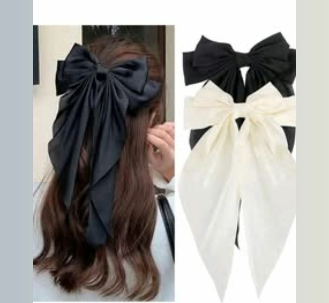 Big black bow and small pink and white bows