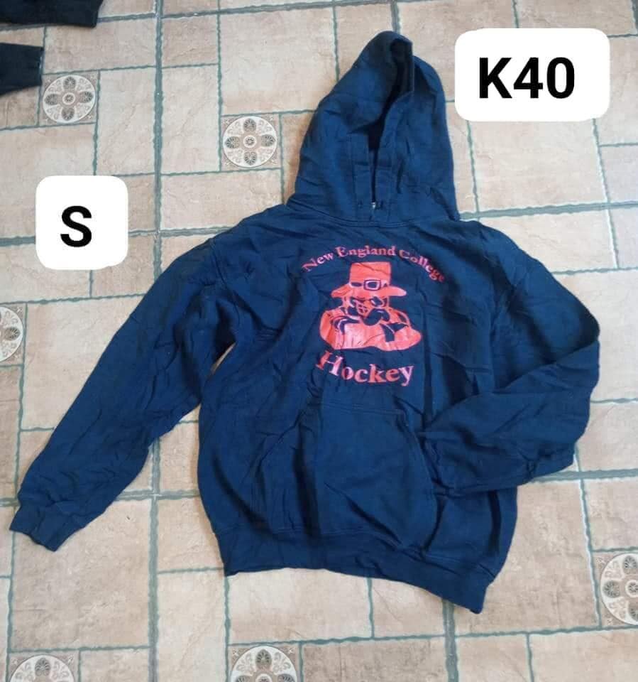 sweatshirt is blue with a red print
