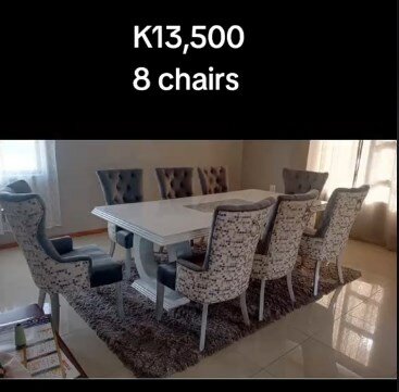 8 grey printed chairs + white table