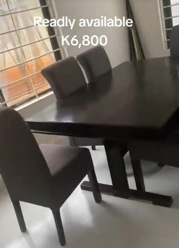 Table and 4 grey chairs