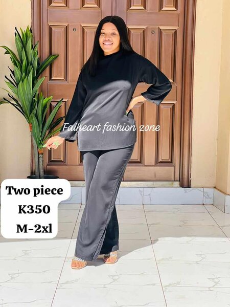 Women's suit is black, long-sleeved tunic and trousers   M-2xl