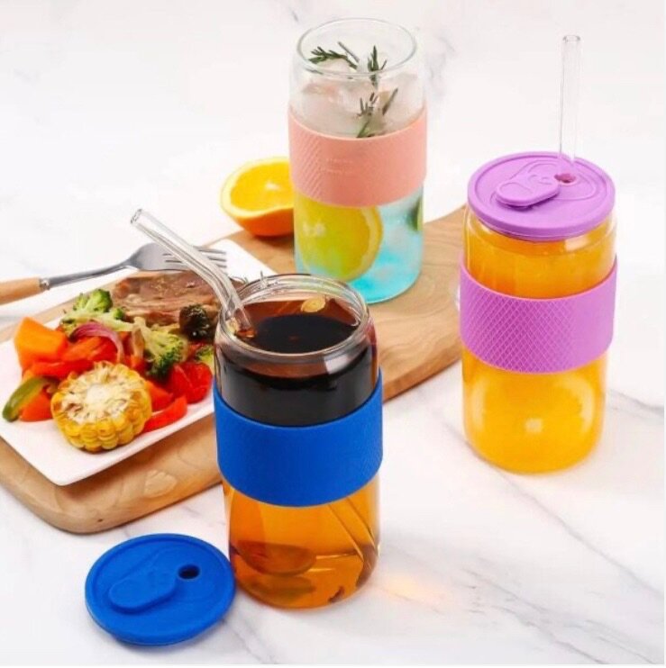 Glass tumbler with silicone lid and sleeve