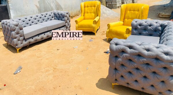 A set of furniture, gray sofas and yellow armchairs