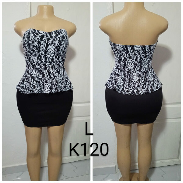 Women's dress is black with a white lace top , size L