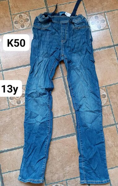 blue jeans for a teenager with a belt