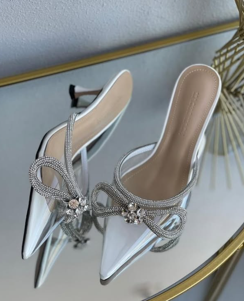 silver shoes with a bow tie