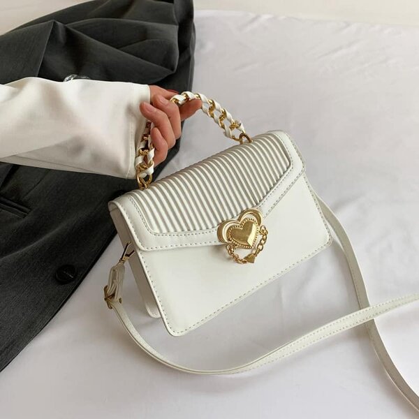 High-quality, stylish women's bag decorated with a heart