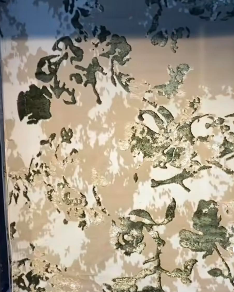 Carpet with abstract green pattern on beige background