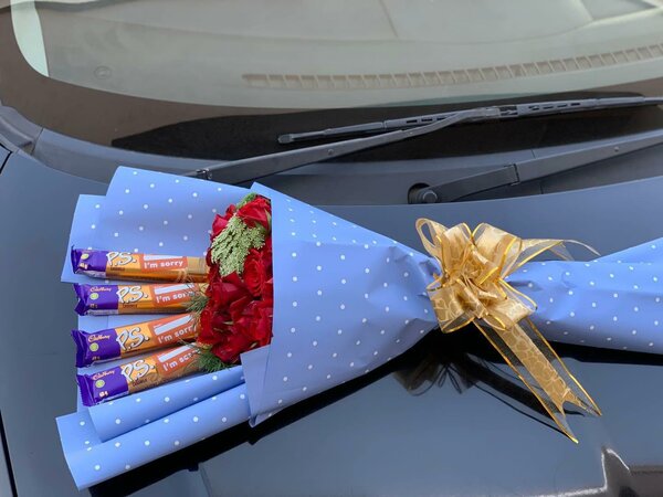 Bouquet with flowers and sweets