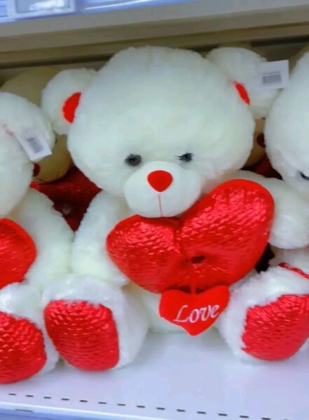 Ours en peluche rouge et blanc