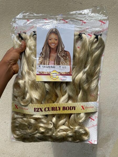 Extensions cheveux bouclés blond