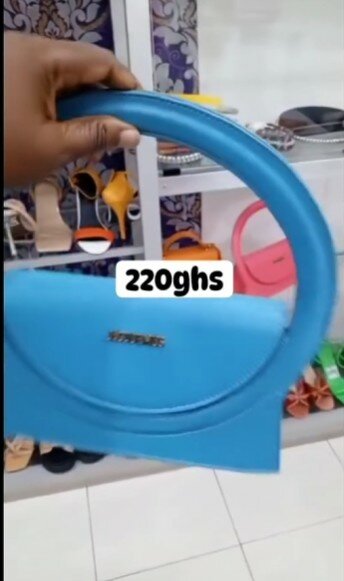 Small blue handbag with round handle