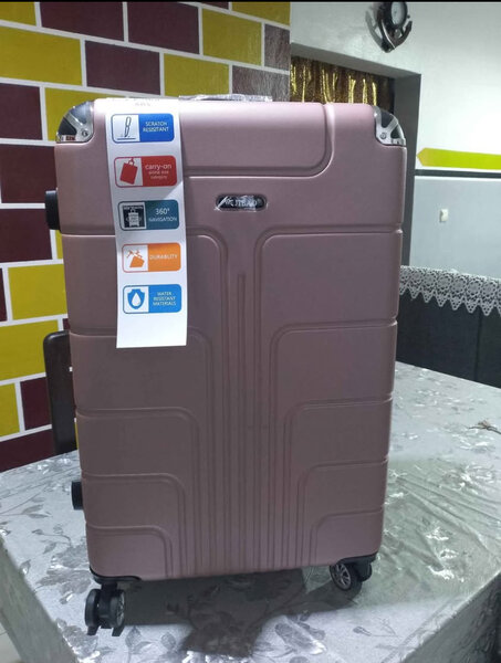 Valise rose ABS robuste pour voyages